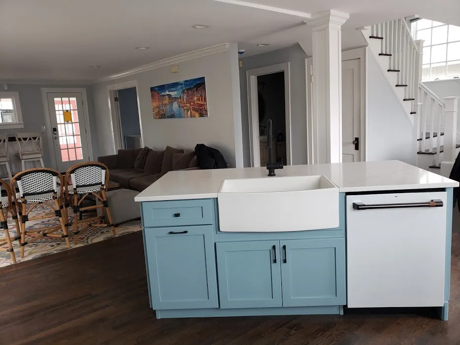 Blue island with white farmhouse sink