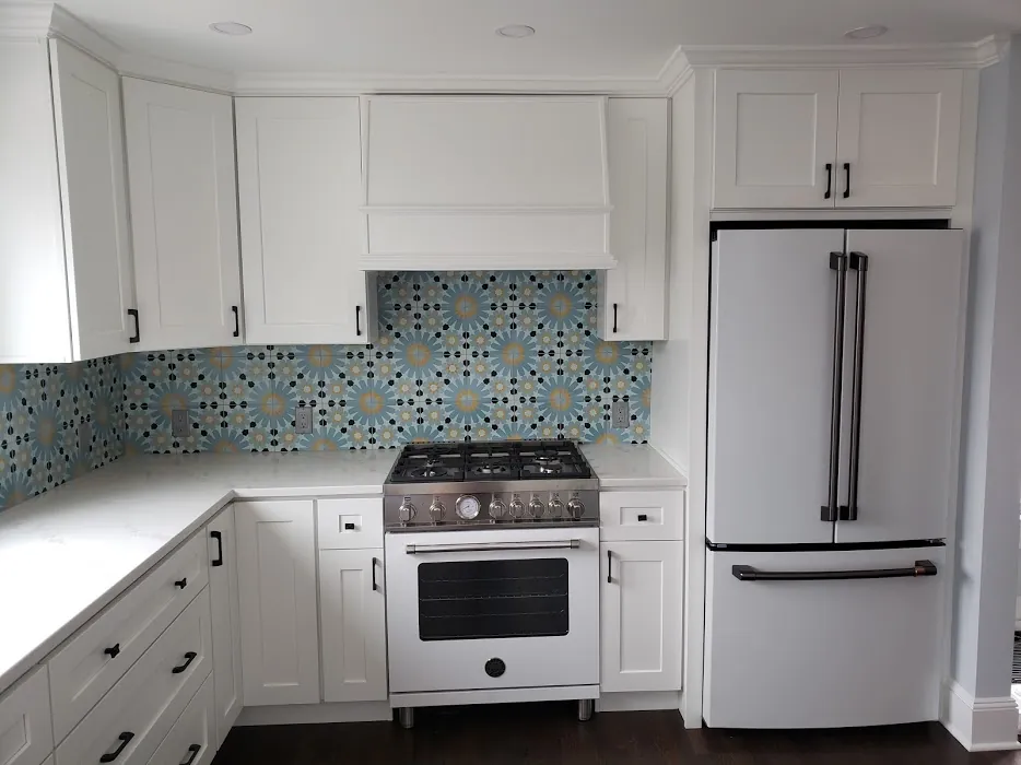 White kitchen with patterned tile backsplash
