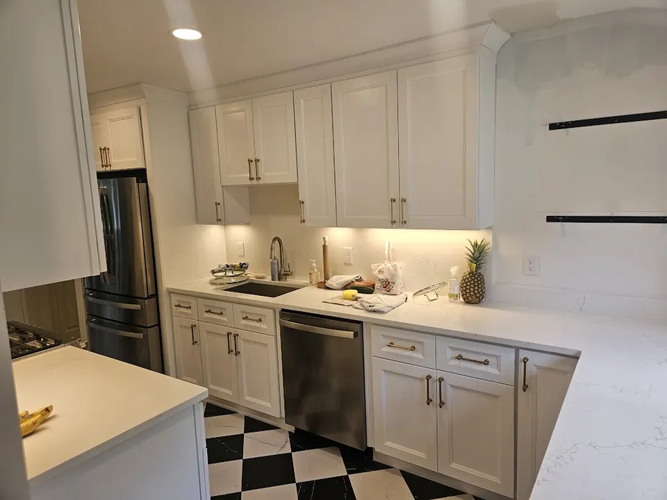 White kitchen with checkerboard floor