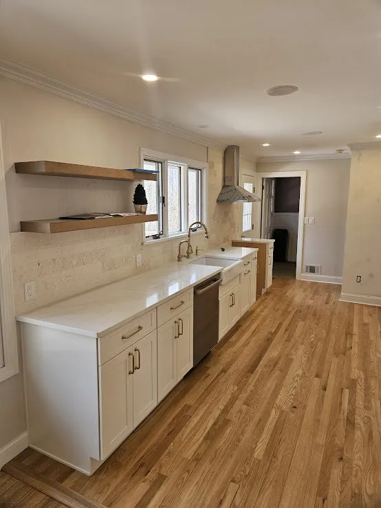 Galley kitchen with floating wood shelves